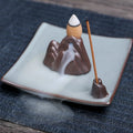 Ceramic reverse flow incense burner in purple clay with crystal glaze featuring lotus or plum blossom design