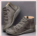 Women's flat wedge heel ankle booties in various colours including leopard print, with round toe and rubber sole.