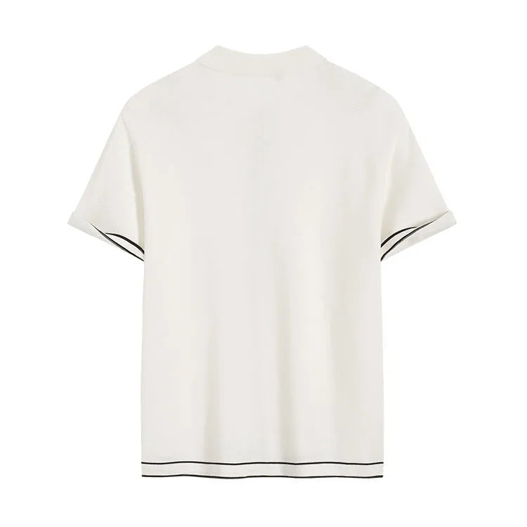 White short sleeve cardigan with contrasting colour lapels laid flat.