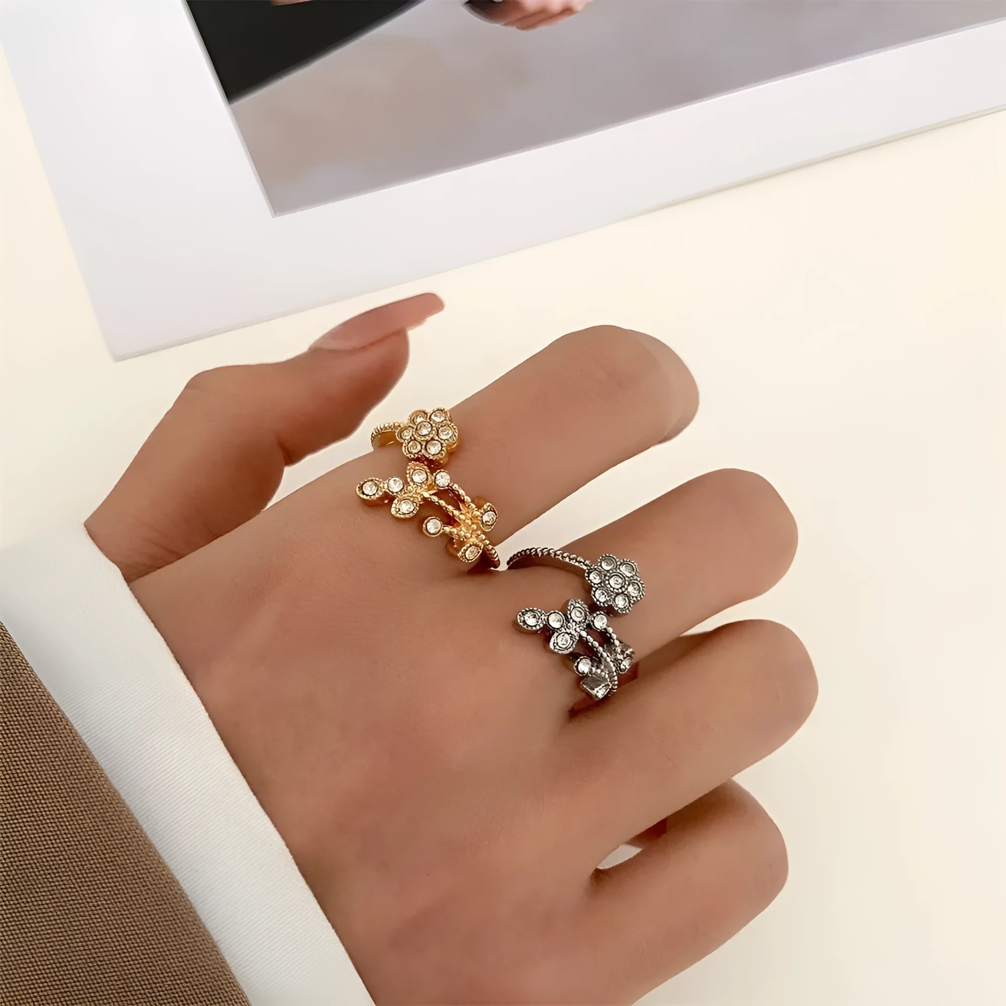 Women's copper floral open ring with diamond finish showing gold and white colour options