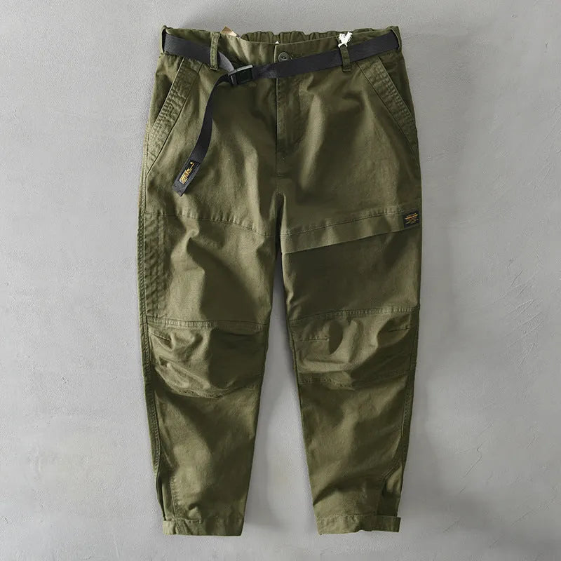Men's loose-fit cotton overalls in army green colour, showing casual Japanese style and mid-waist design.