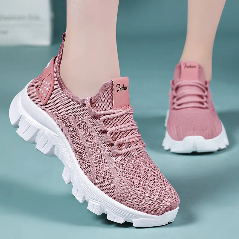 Men's white Flyknit lace-up running sneakers with a thick PVC sole on a plain background.