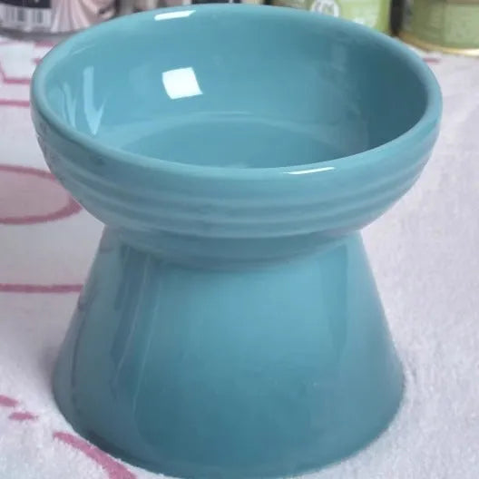 Black ceramic pet bowl with high foot and neck design for anti-tumble feeding