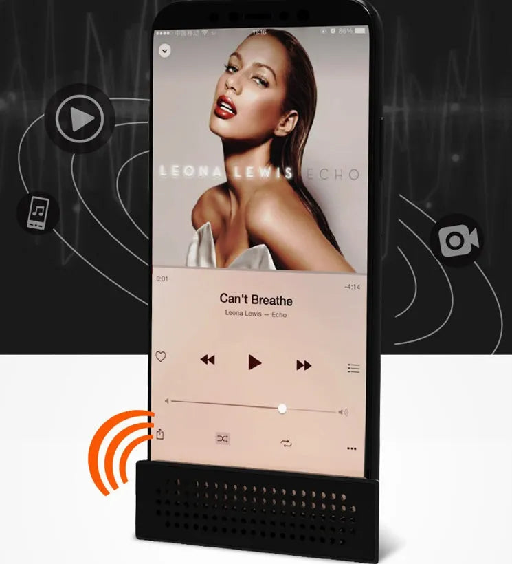 Portable Apple-compatible phone amplifier bracket in multiple colours on desktop