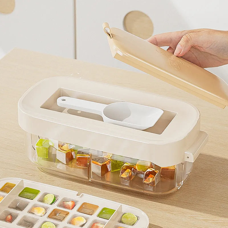 Yellow lever-operated ice cube tray grid with high capacity design and stored ice shovel.