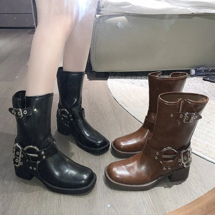 Women's platform boots with belt buckle detail at mid-calf length