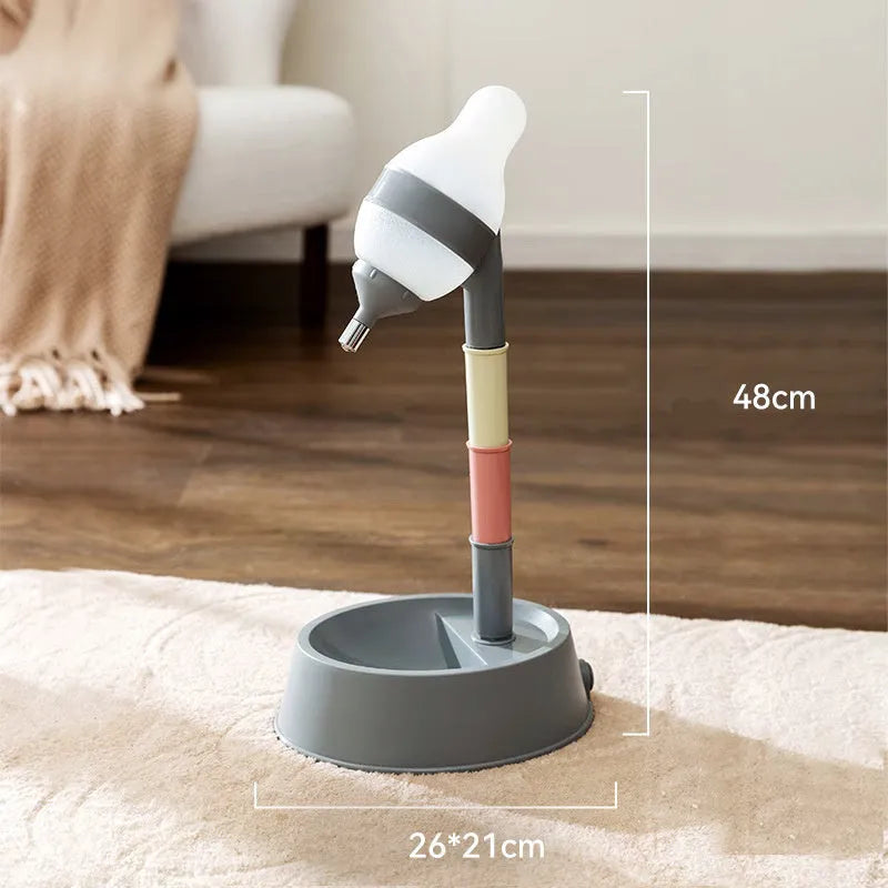 Green height-adjustable pet water dispenser with detachable pole and weighted bowl on a floor.