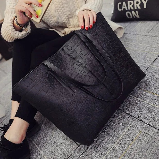 Minimalist European-inspired shoulder handbag in black or grey with adjustable strap