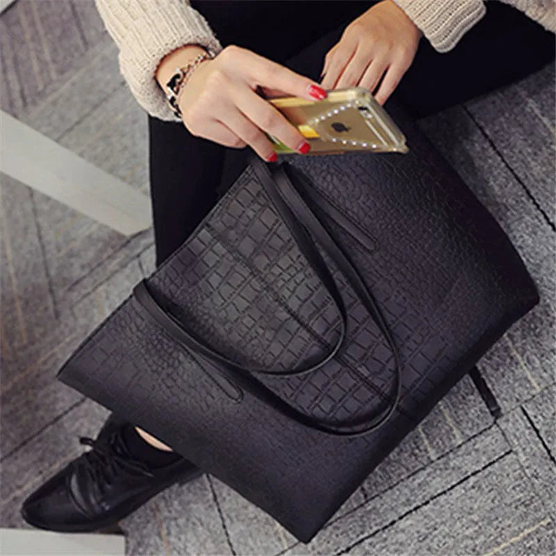 Minimalist European-inspired shoulder handbag in black or grey with adjustable strap