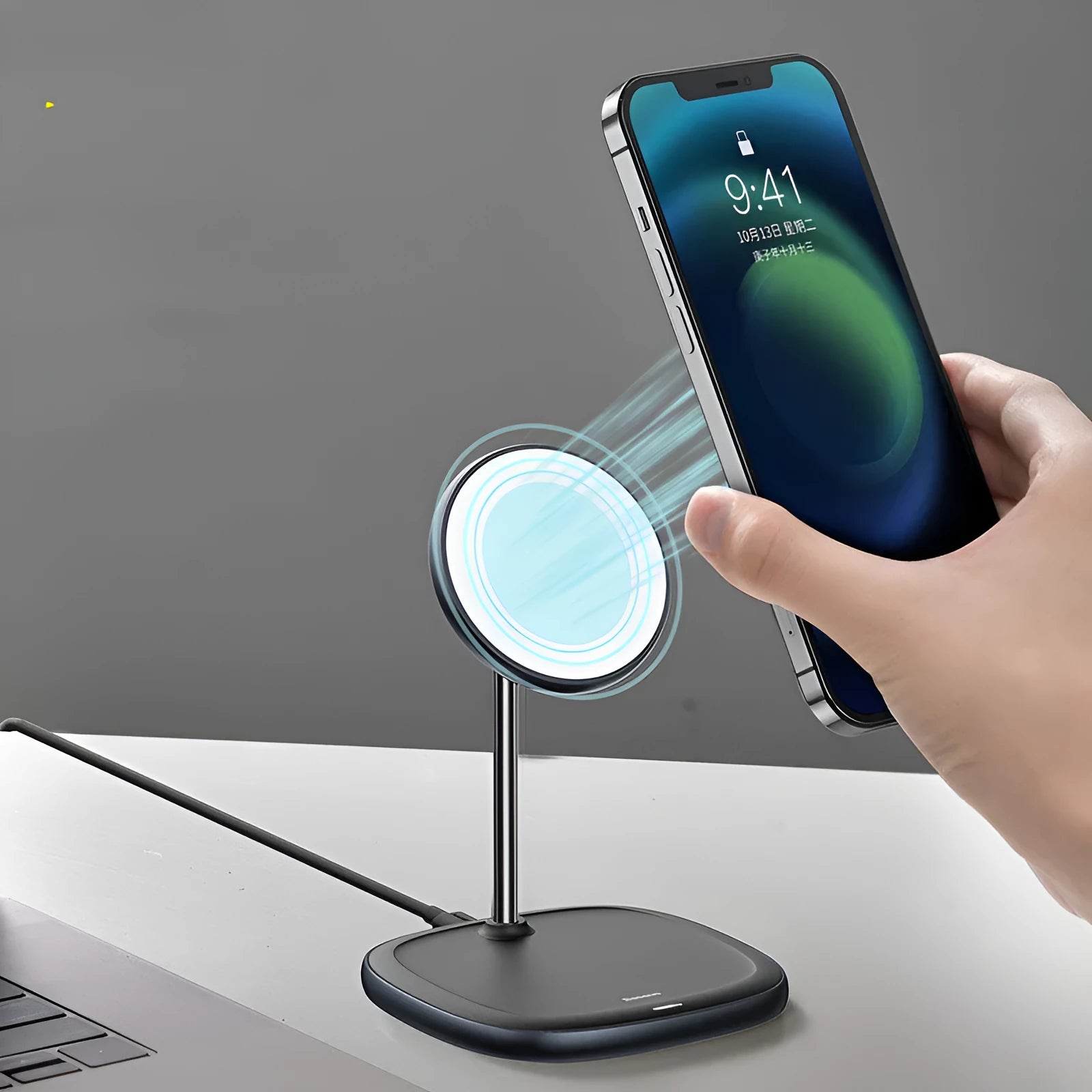 Black Swan magnetic wireless charging stand for Apple iPhone 12 series on a desk.