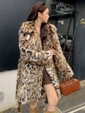 Women's long faux fur coat with fur collar and pockets in street fashion style