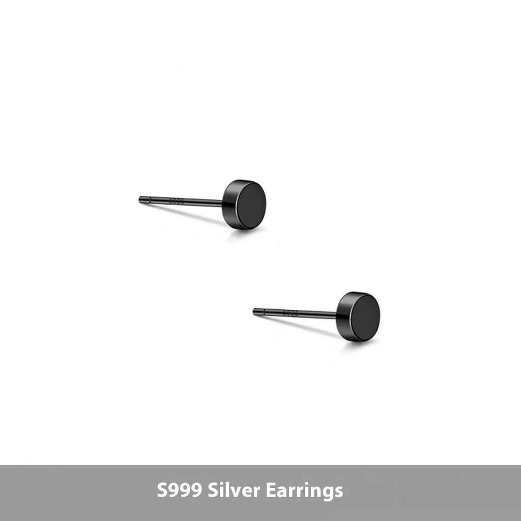 A pair of simple round S999 sterling silver flat ear bone studs on a plain background.