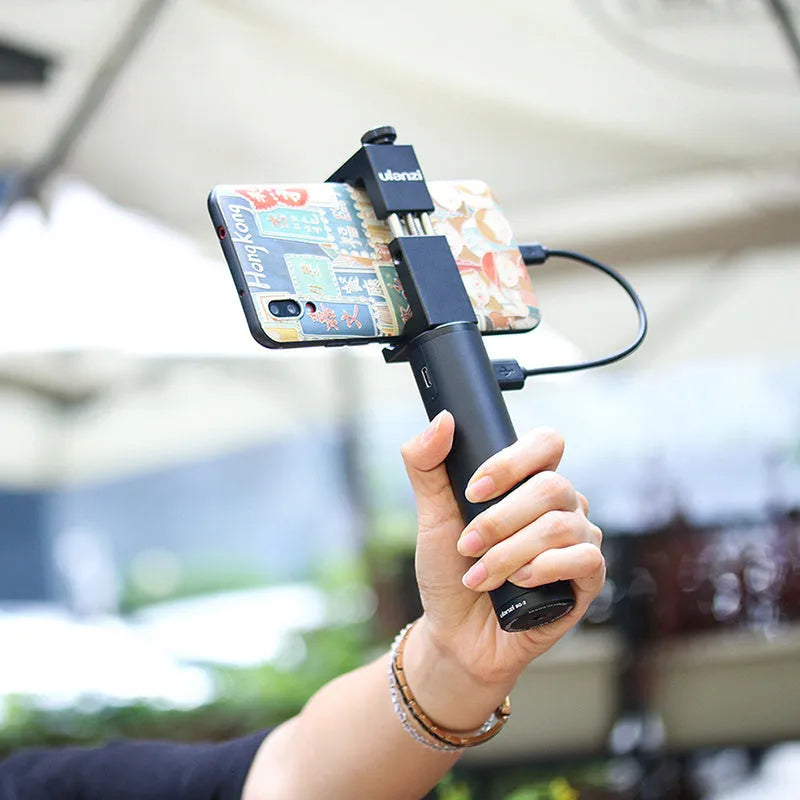 Black aluminium power bank with a carry handle, showing slim 12.5cm length.