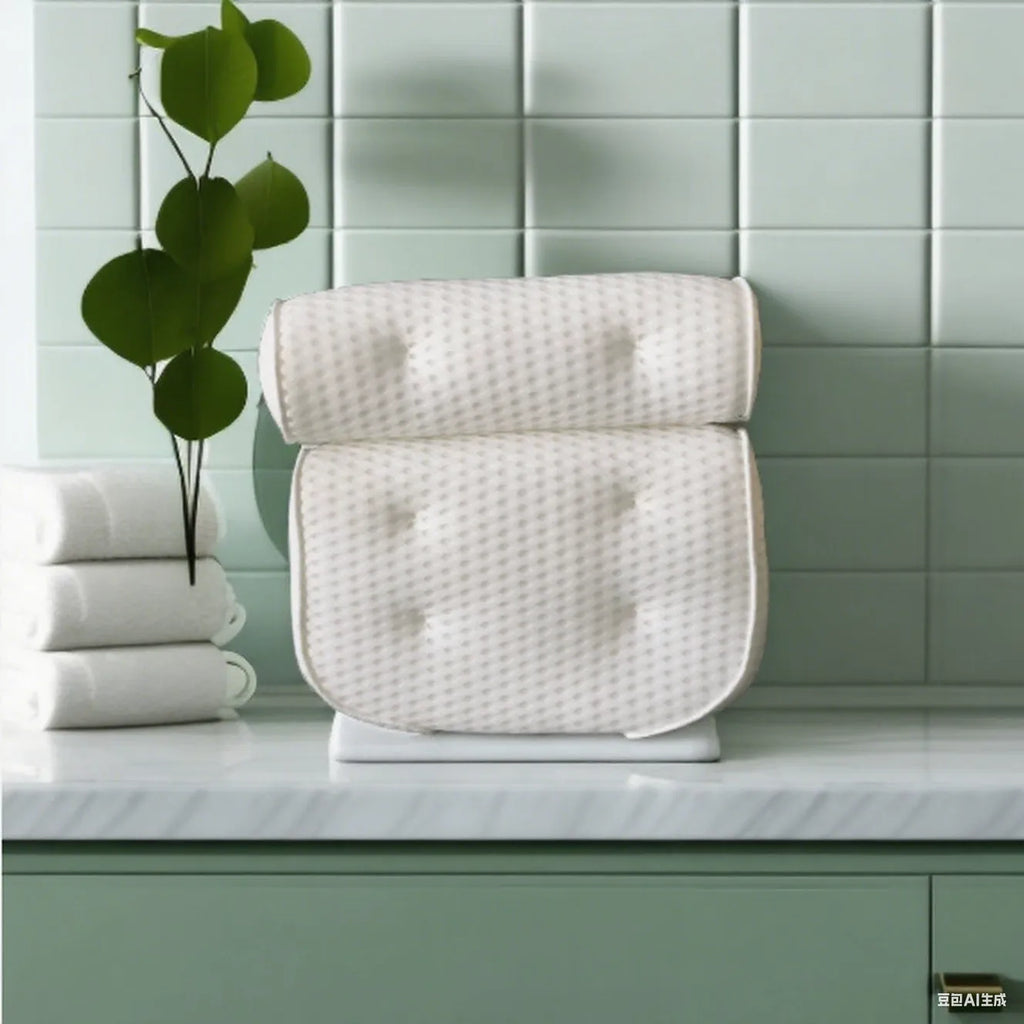 White bathtub pillow with 4D mesh fabric and suction cups on a flat surface.