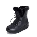 Women's black platform winter boots with lace-up closure and plush lining.