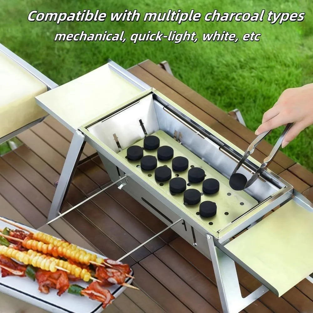 Small foldable portable charcoal grill for outdoor use.