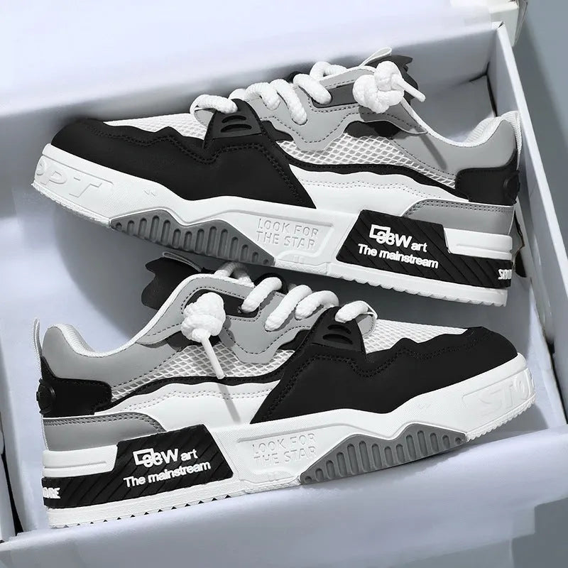 Men's low-top canvas board shoes in a colour-matched pattern with a flat rubber sole.