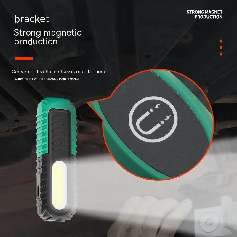 Black and green USB-charged automotive inspection work light with compact design