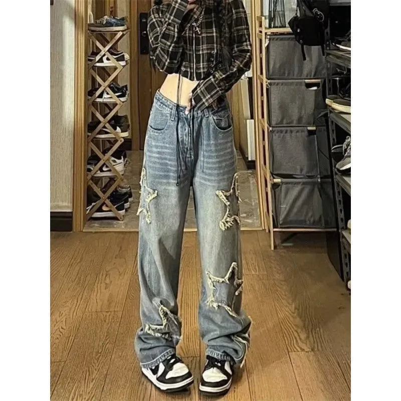 Blue high-waisted wide-leg women's jeans made from cotton denim on a model.