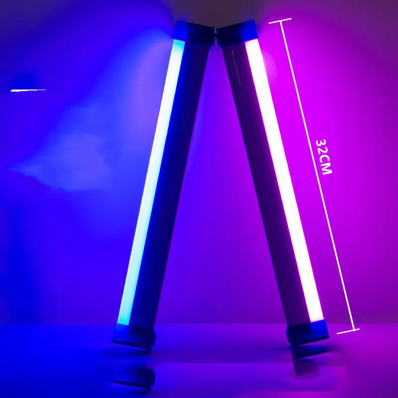 Blue and purple rechargeable dimmable LED tube stick light in 32cm length on a dark surface.