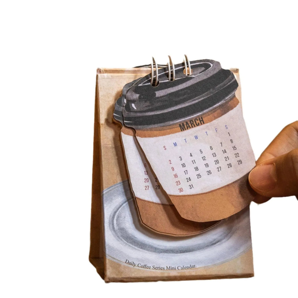 Mini A5 desk calendar 2025 showing one of eight themed designs in simple modern style