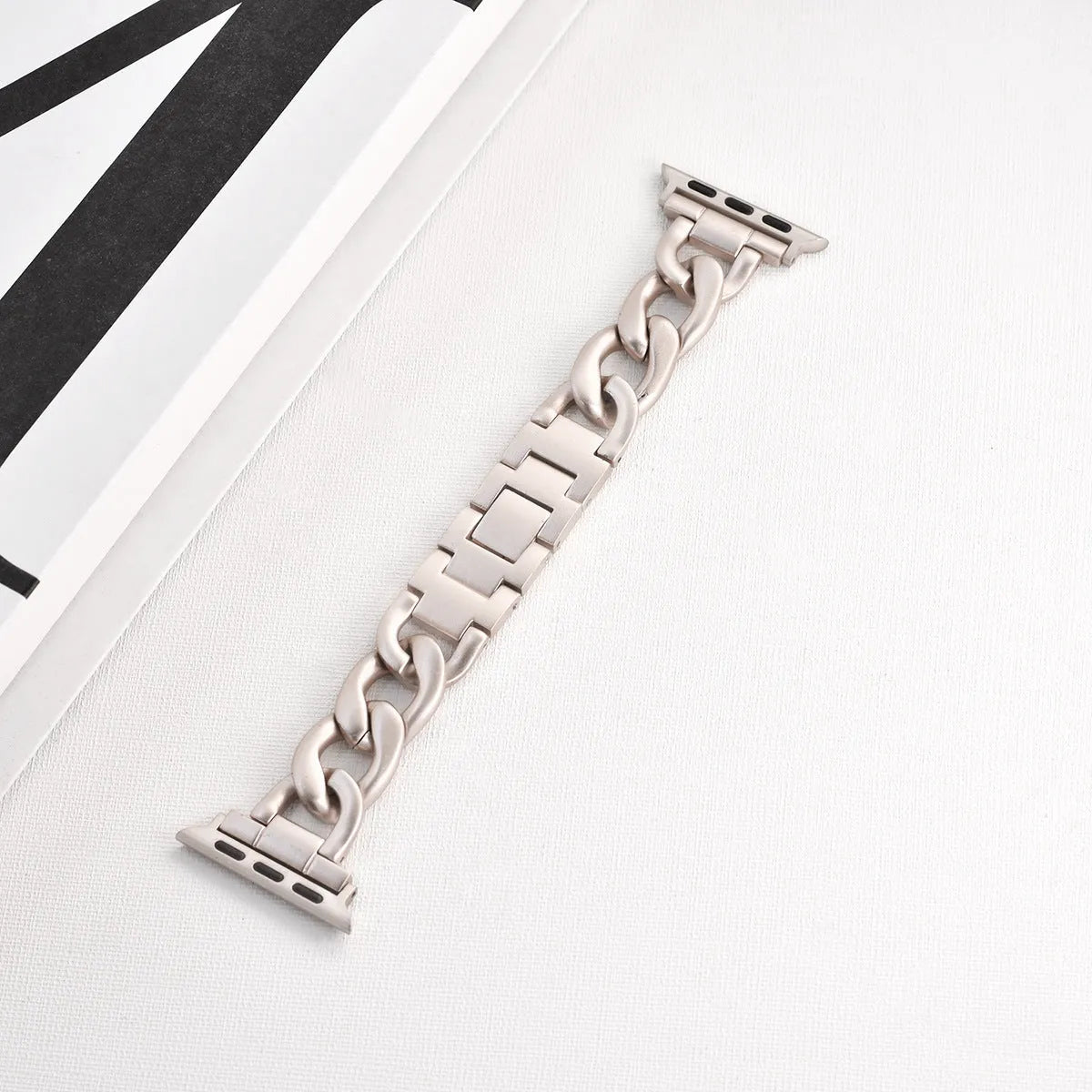 Denim chain link metal Apple Watch replacement strap in silver, black, gold, rose gold, and Starlight colours.