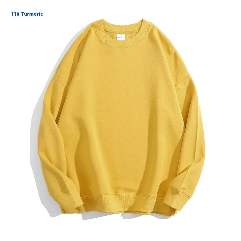 A loose round neck off shoulder pullover sweater in a solid colour, with long sleeves.