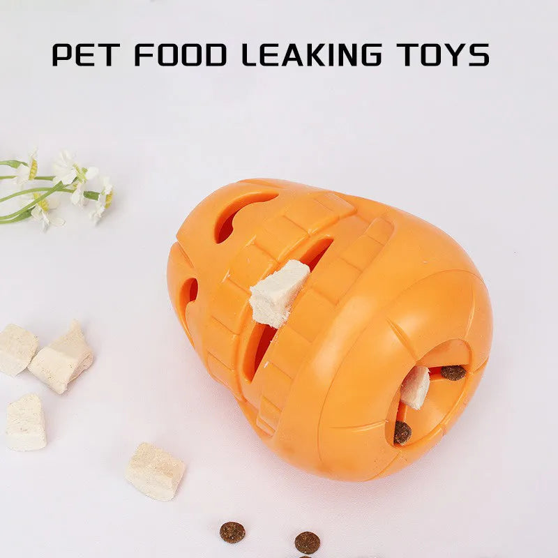 Orange Halloween pumpkin-shaped rubber dog chew toy with a treat-dispensing funnel hole.