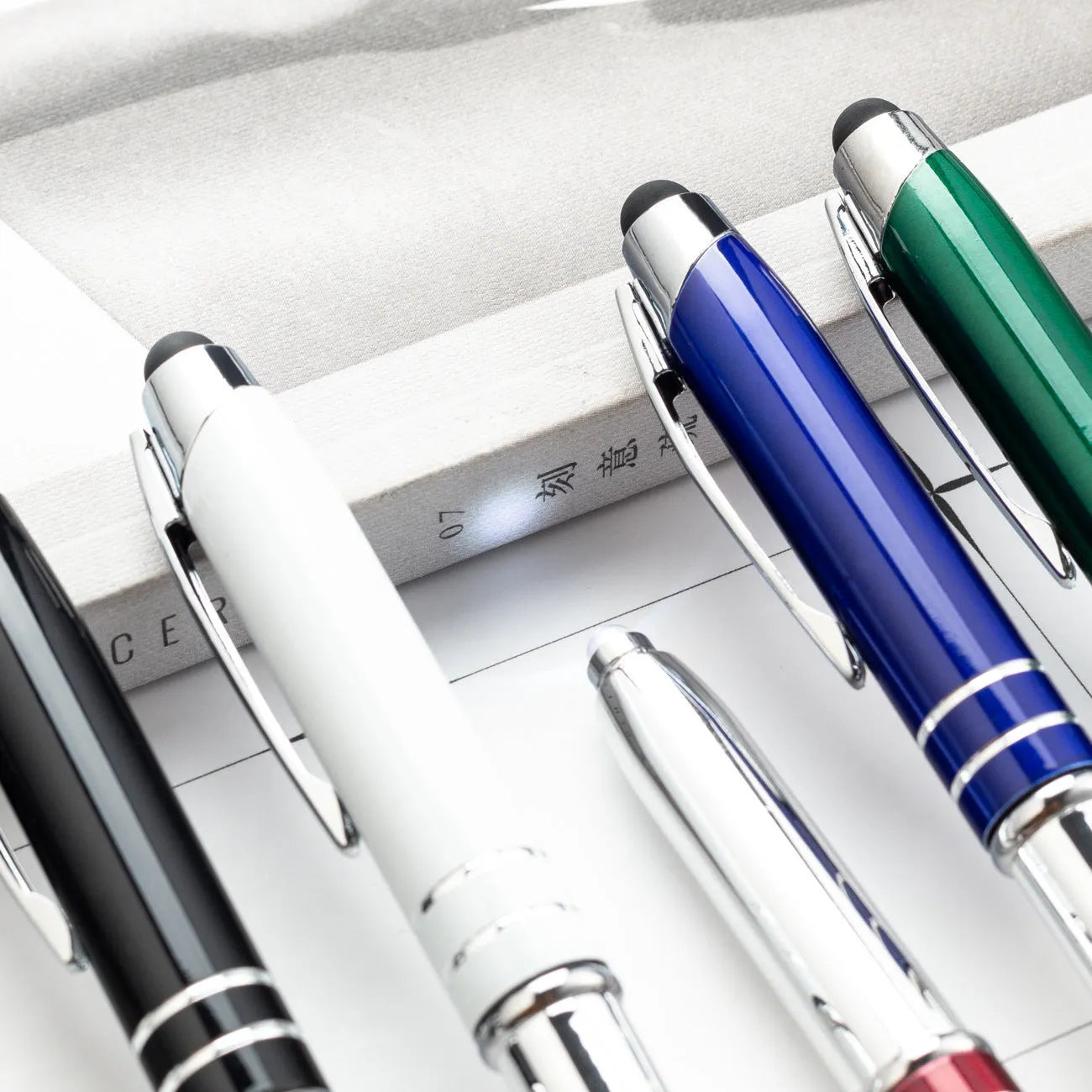 Metal capacitive stylus and ballpoint pen with LED light in five colour options.