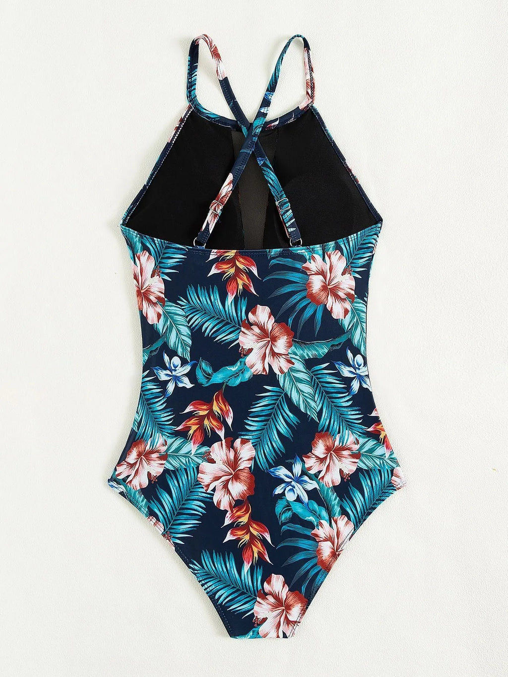 Women's deep V-neck one-piece swimsuit in a printed design, available in sizes S to XL.