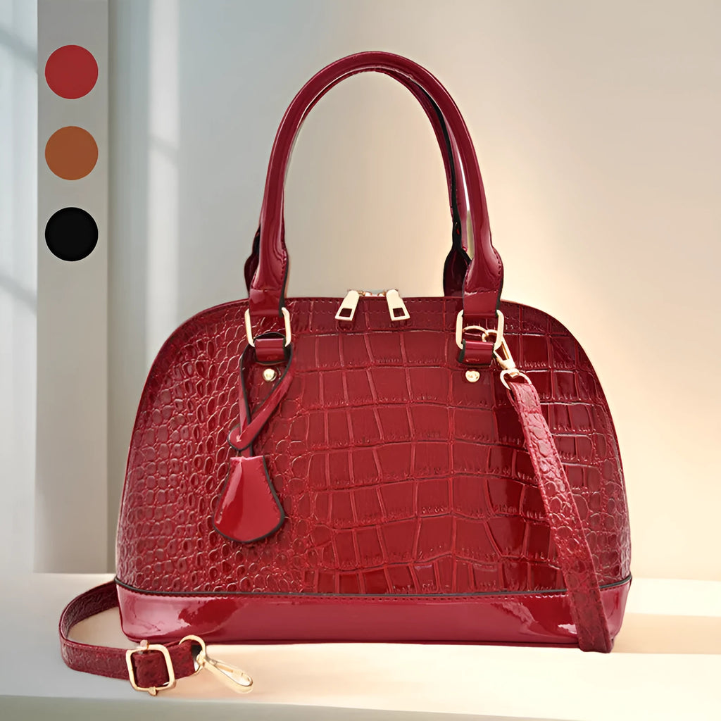 Shiny black PU leather shell-shaped crossbody bag showing its structured design and size.