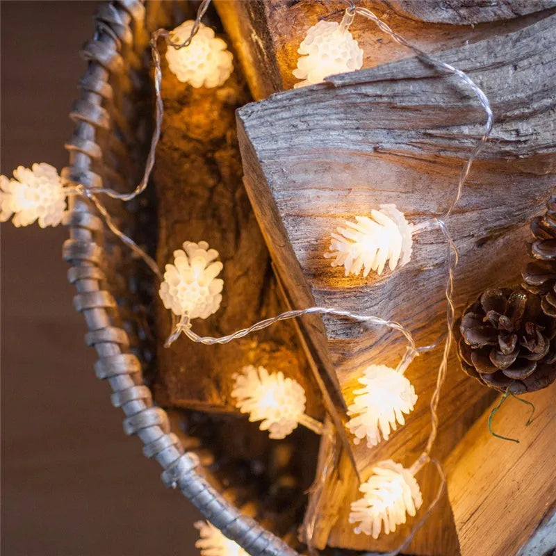 Warm white battery-powered LED pine cone decorative string lights shown in a 10-light or 20-light option.