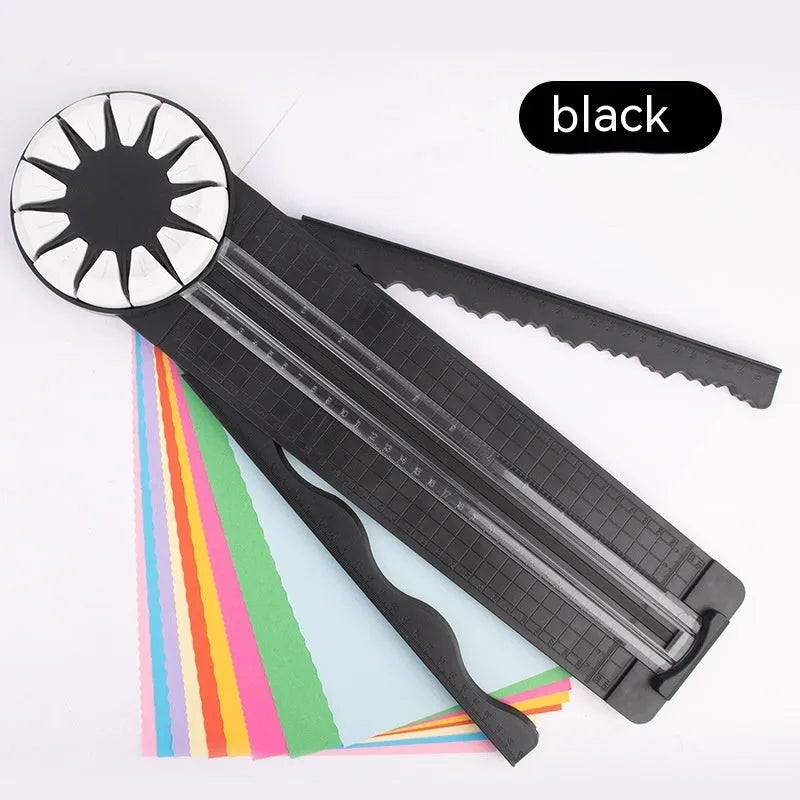 Pink 12-in-1 dotted line paper cutting machine on desktop for card making and scrapbooking