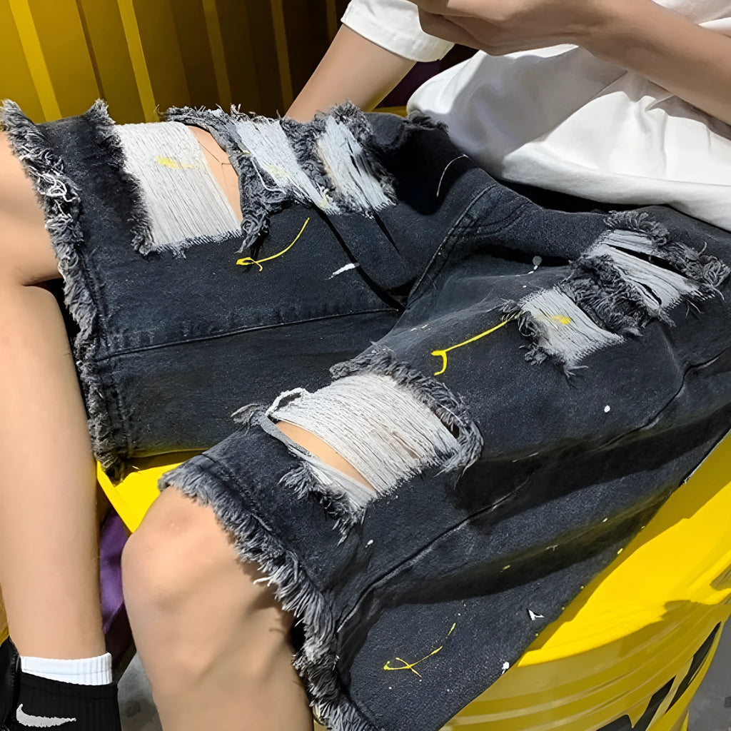Men's loose fit light blue water washed denim shorts on a hanger.