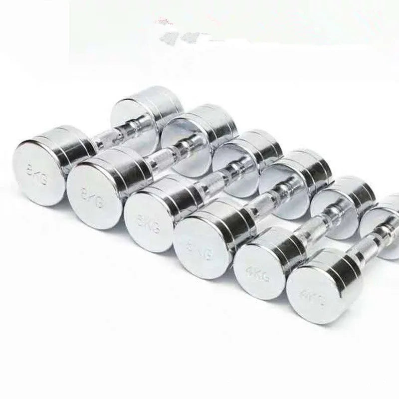 Silver electroplated steel dumbbell with hexagonal handle on a gym floor
