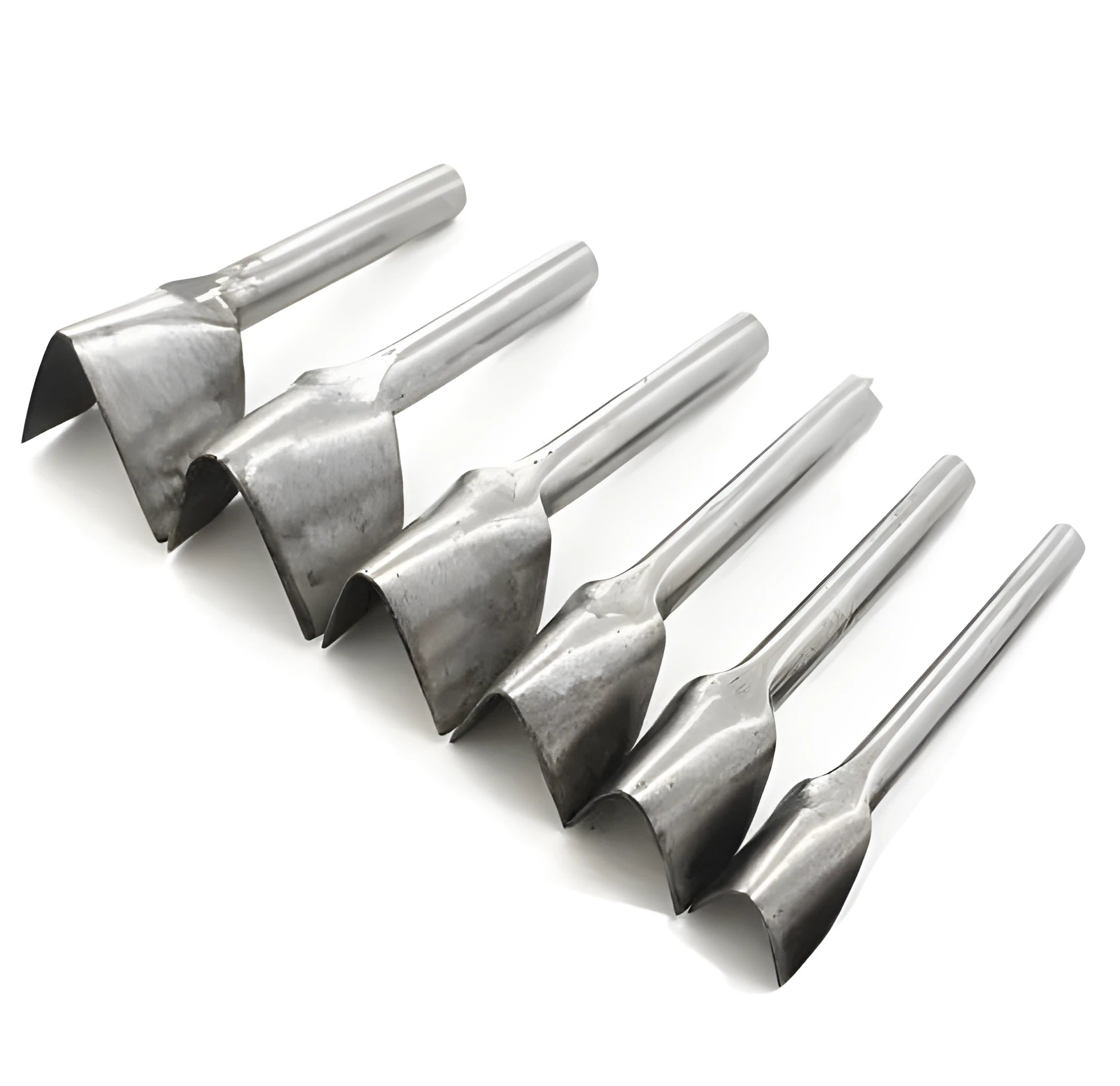 Set of six steel leather punch tools showing half-round and V-shapes on a work surface.