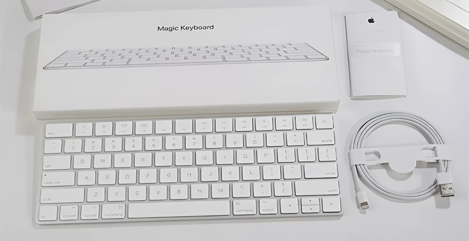 Apple G6 ultra-thin aluminium Bluetooth wireless keyboard in white, showing multimedia function keys.
