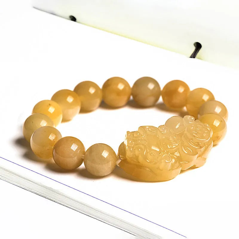 Hand-carved Jinsi Jade money bracelet showing golden thread patterns, displayed in large and small size options.