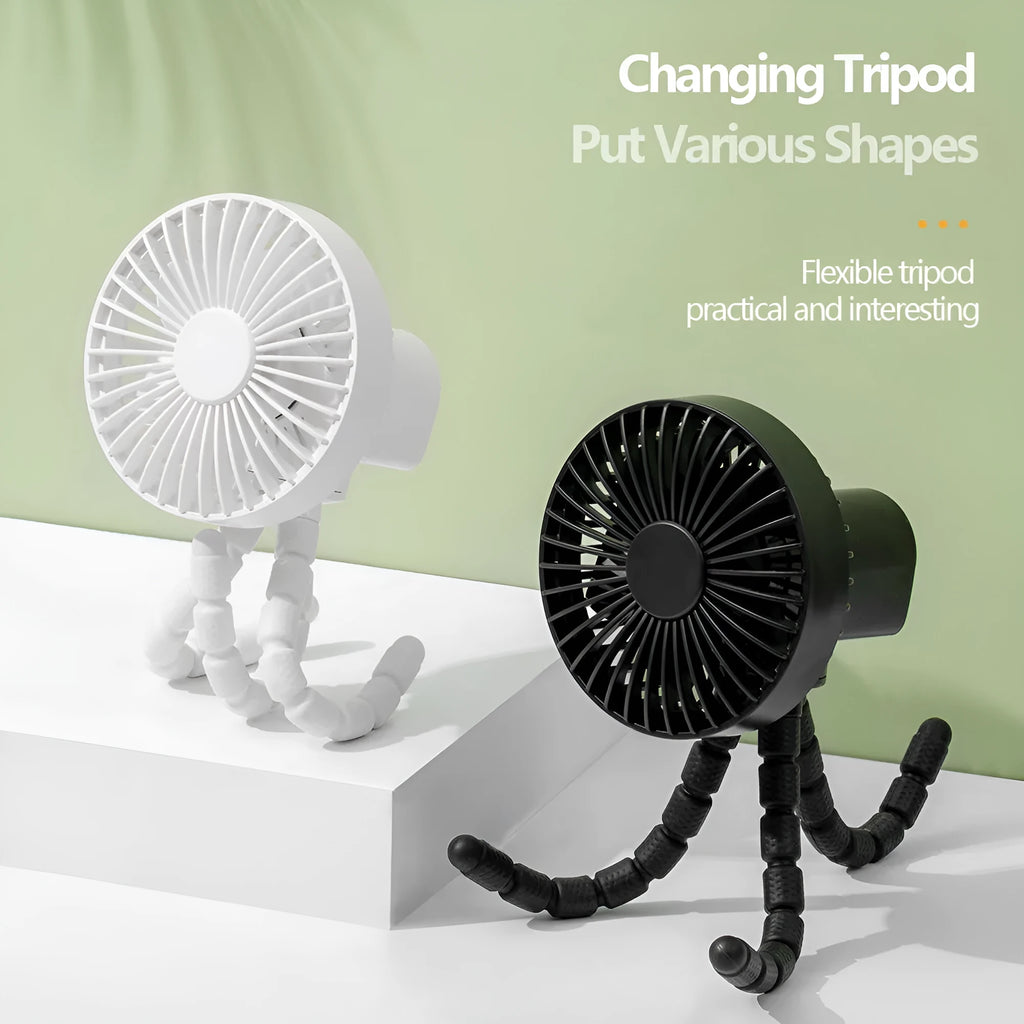 Black flexible tripod USB desktop fan with automatic head shake, shown on a desk next to a laptop.