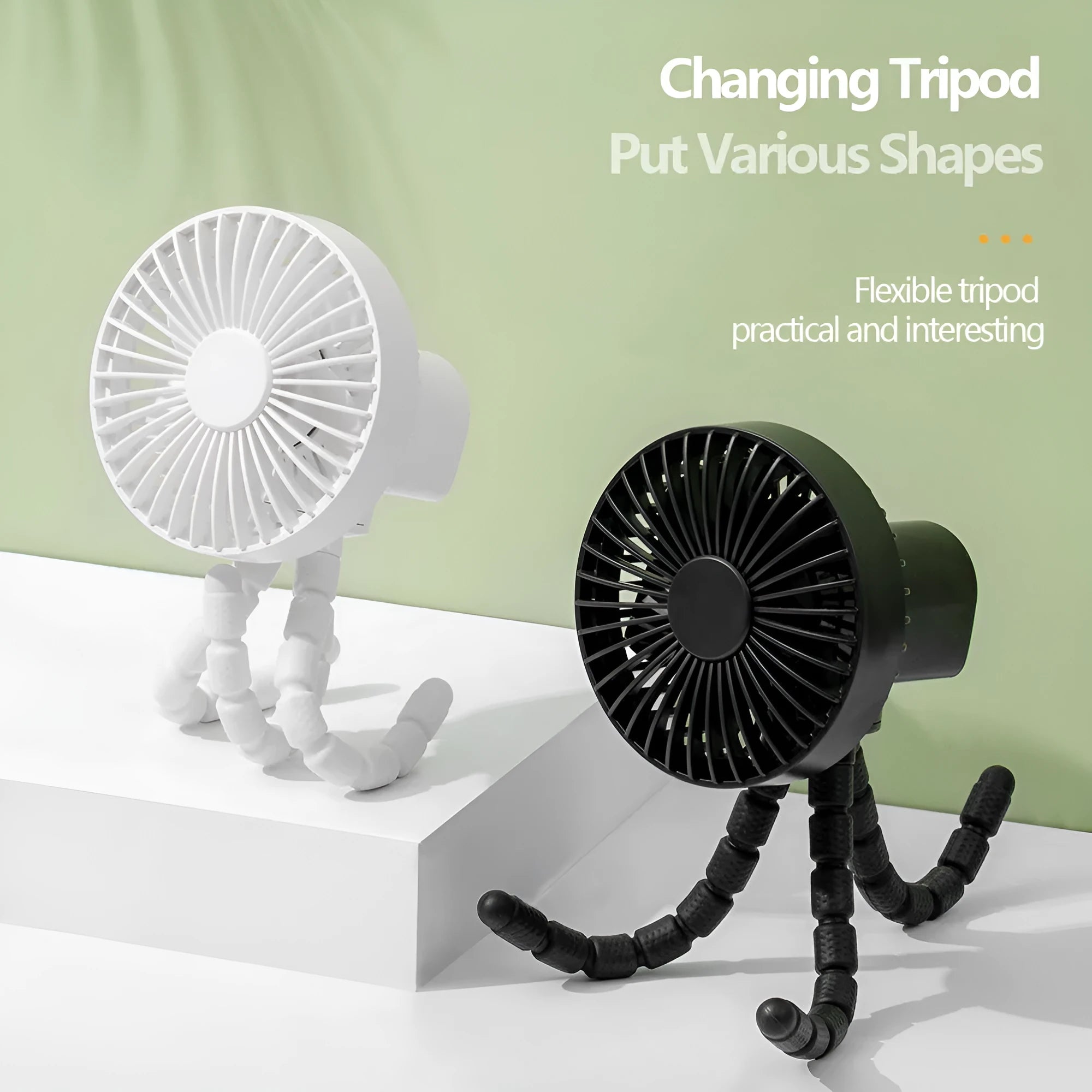 Black flexible tripod USB desktop fan with automatic head shake, shown on a desk next to a laptop.