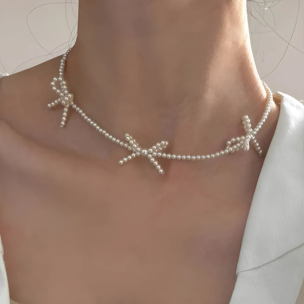 Sweet bow pearl necklace with geometric charm on adjustable 31-40cm chain