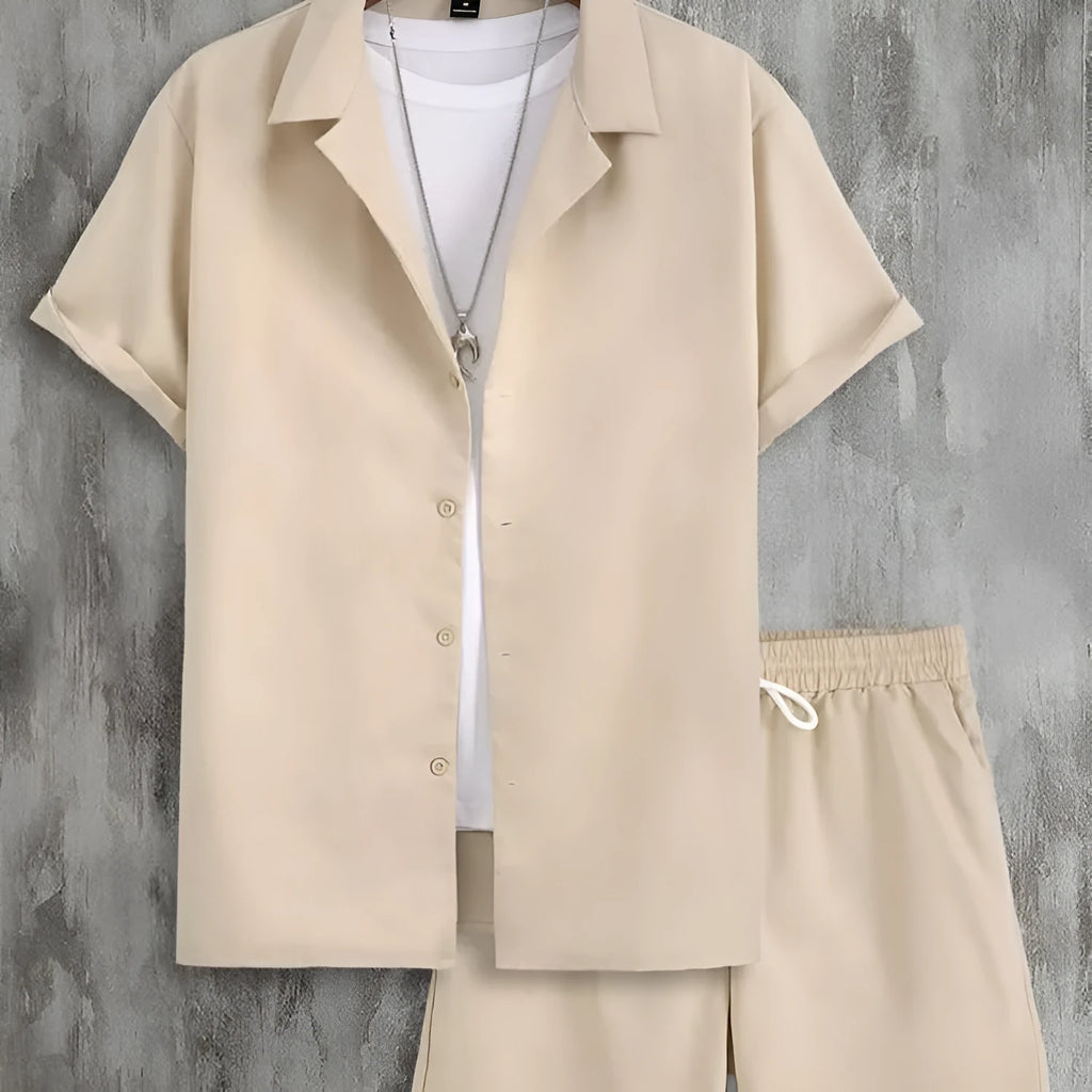 Man wearing a white short sleeve Cuban collar sport jacket with matching shorts.