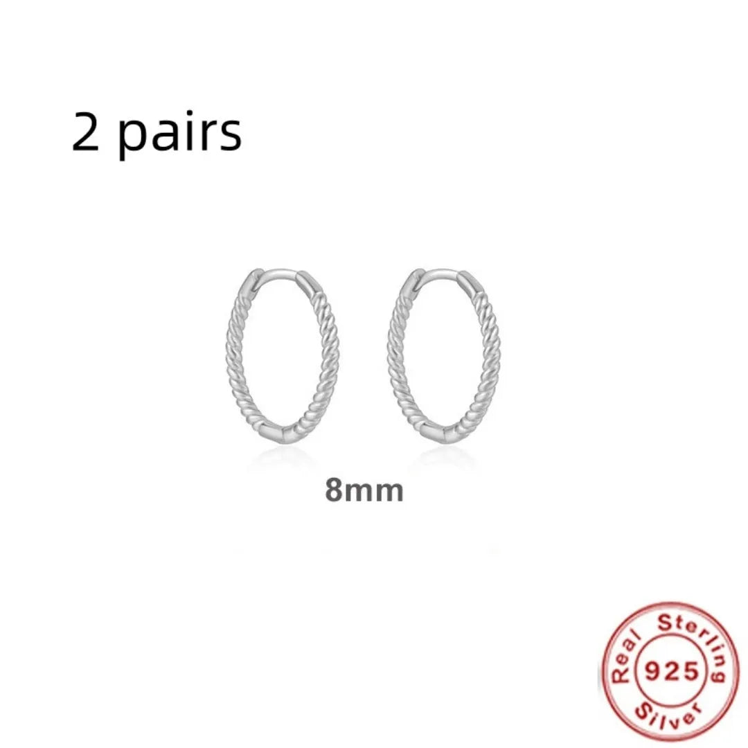 Sterling silver twisted hoop earrings with geometric round shape in gold electroplated finish