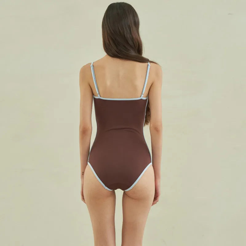 Brown nylon one-piece triangle swimsuit for women laid flat.
