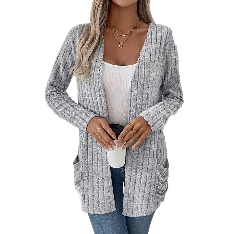 A loose-fit, solid colour long sleeve cardigan for women with a chest pocket, shown in grey and black.