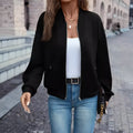 Women's black casual zip jacket with long sleeves and faux pocket detail