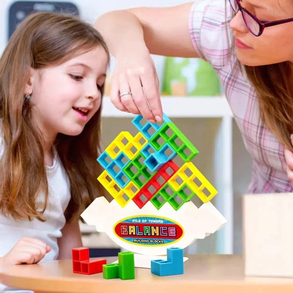 Plastic balance stacking board game with 16 colourful blocks, chassis, and base in a 26.5cm square box.