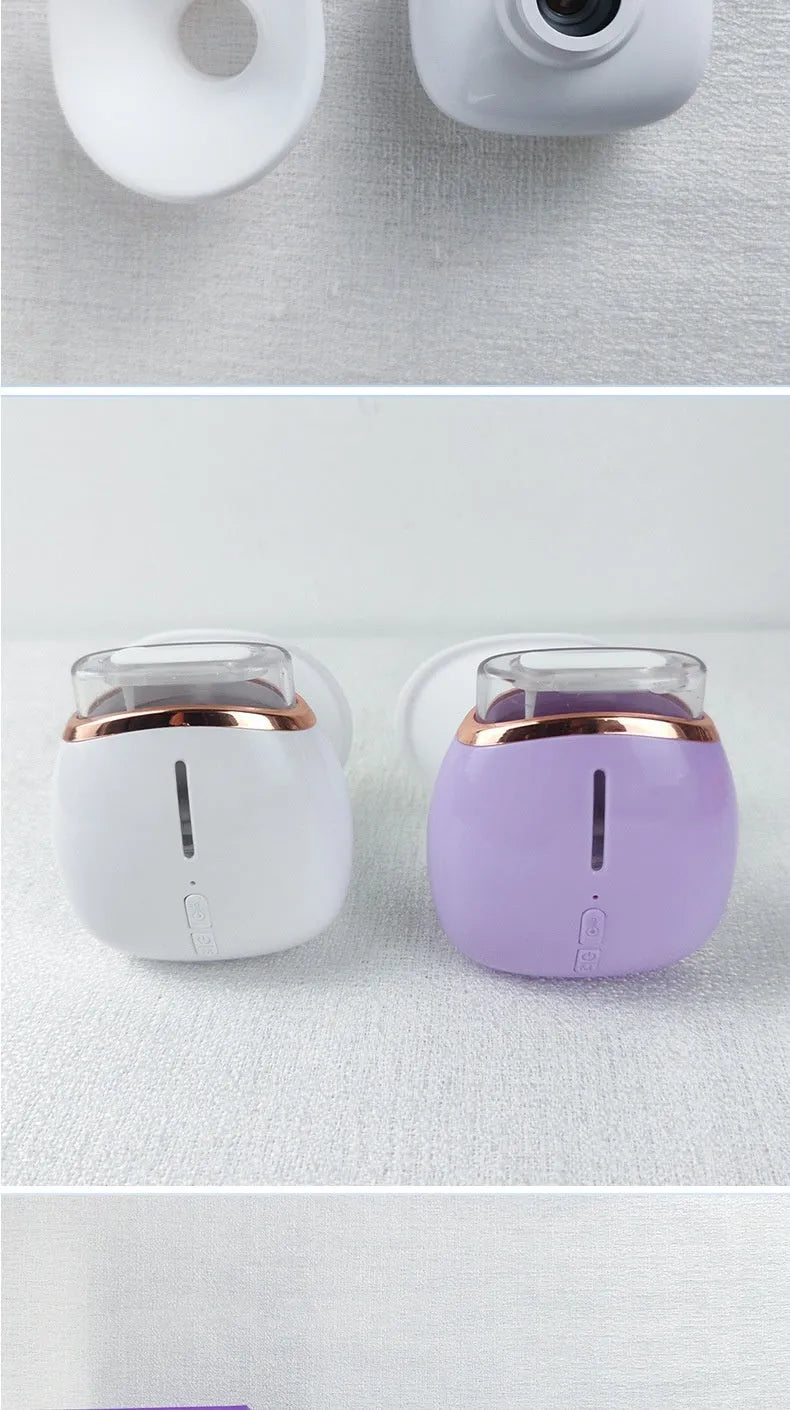 Purple and white household eye humidifier with charging cable on white background