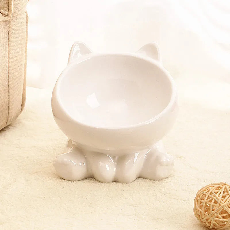 Ceramic cat bowl with neck guard in black and white and pink and blue colour options on a white background