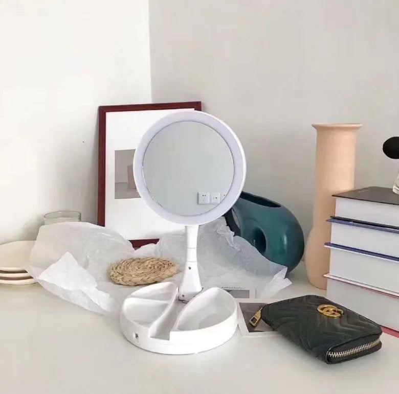White acrylic frame vanity mirror with LED lights, USB charging port, and foldable design showing storage compartments